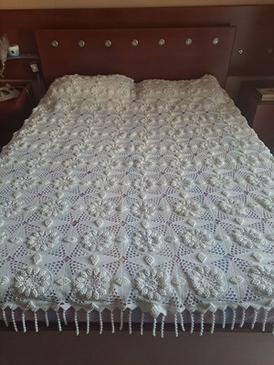 Handmade super double blanket with embossed designs and crocheted fringes