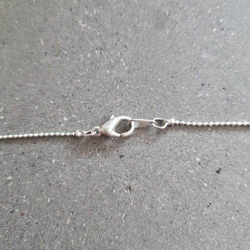 Necklace with hanging chain and stones