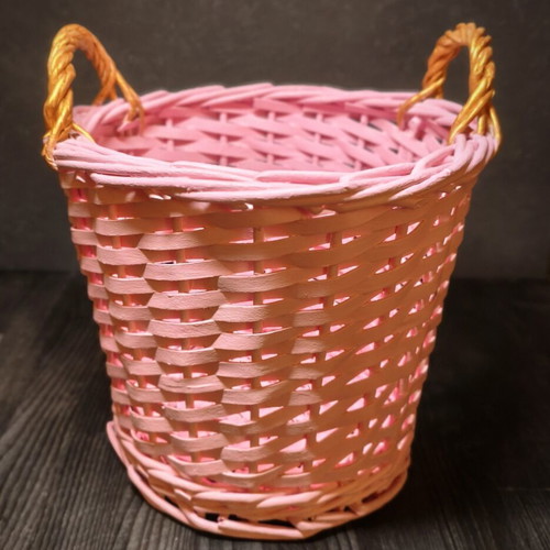 Decorative pink rattan basket with gold handles, handmade