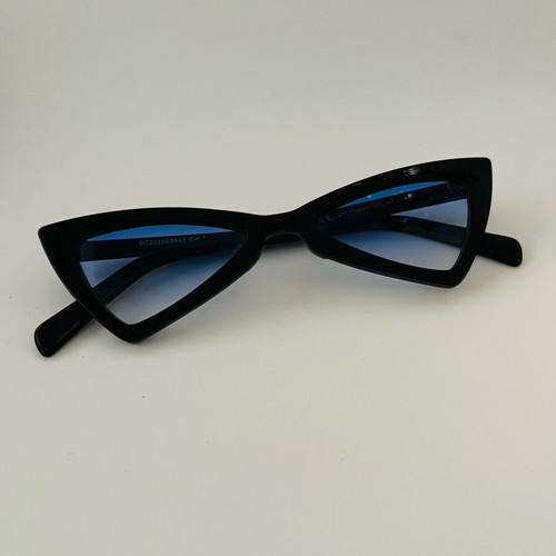 Glasses with blue triangular lens used, black frame