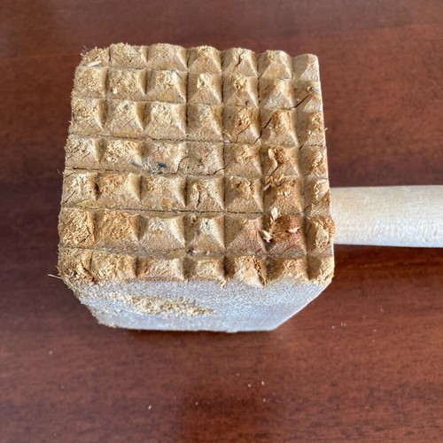 Wooden meat tenderizer used