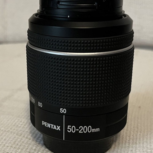 Pentax K-70 SLR digital camera with two lenses and accessories