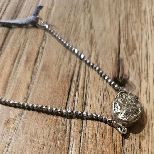 Necklace with leather strap and silver chain like new