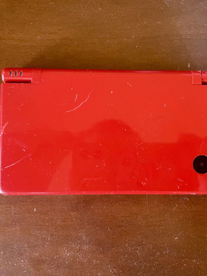 Nintendo DSi console with charger, stylus and memory card