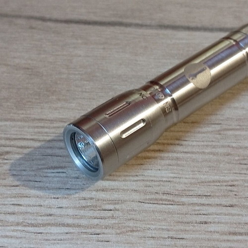 Mini stainless steel LED flashlight like new, AAA battery