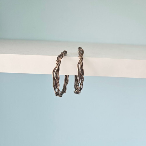 Woven hoop earrings used, bronze by Anna Maria Mazaraki