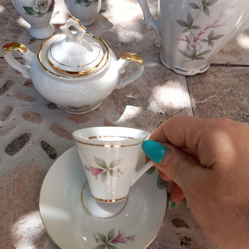 Porcelain tea set collectible with gold details and small vases like new
