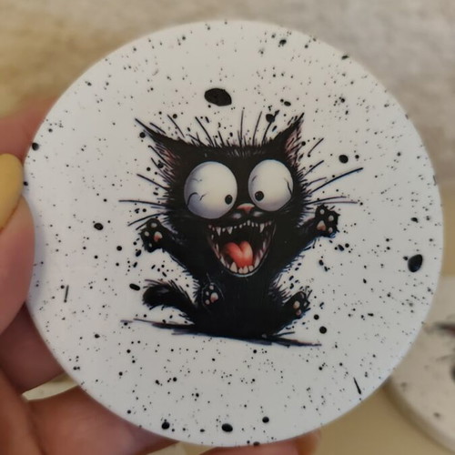 Handmade coasters with black base and 4 playful cat designs