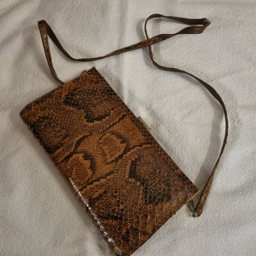 Crossbody bag used with python print leather pattern