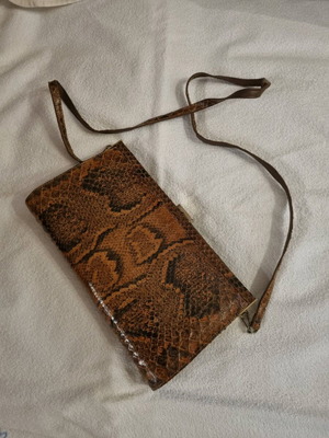 Crossbody bag used with python print leather pattern