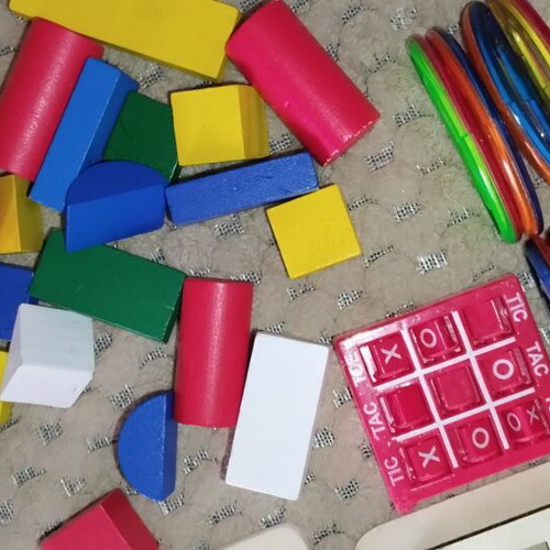 Wooden and magnetic toys used, including plastic mini tic-tac-toe and balls