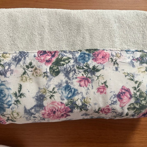 Bath towel used, light blue with printed fabric border