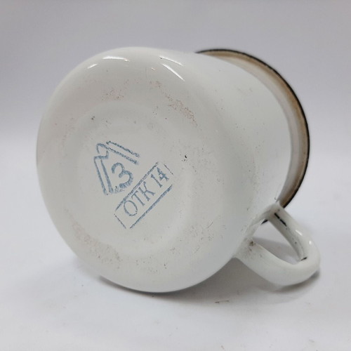 Vintage enamel metal mug with floral motif