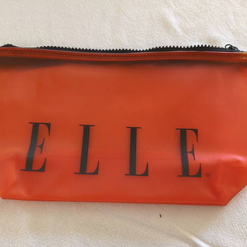 Elle toiletry bag set of 10 like new, translucent orange
