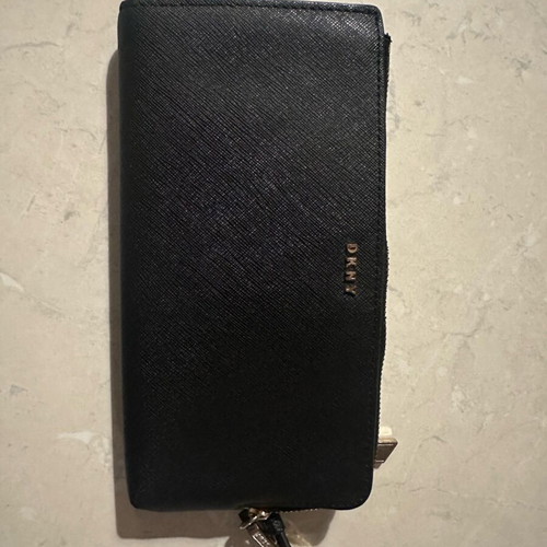 DKNY black women's wallet with zipper and wrist strap used