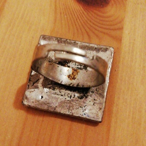 Square statement ring used with black enamel and silver geometric design