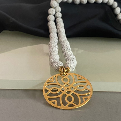 Handmade necklace with lava semi-precious stones and steel motif gray and gold