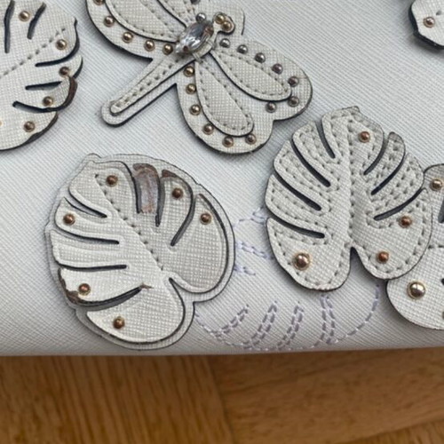 Michael Kors white tote bag with floral and dragonfly details