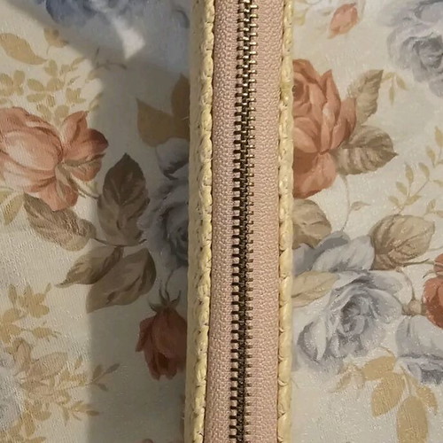 Pink straw wallet used with multiple card slots