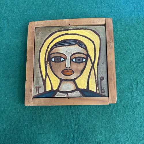 Small ceramic tile by Panos Valsamakis with female face