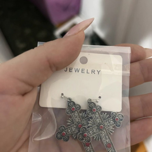 Cross earrings like new with red phosphorescent details