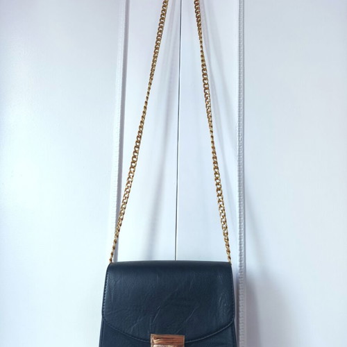 Classic black crossbody bag like new with gold chain for evening wear