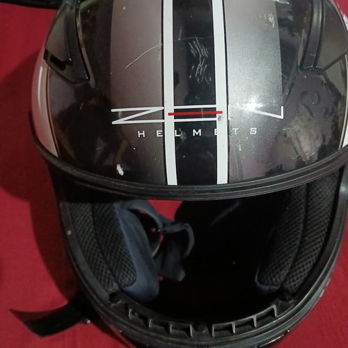 Helmet used, front visor damaged