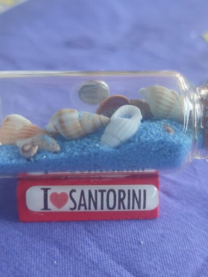 Souvenir from Santorini glass bottle with shells, sand and evil eye magnet like new