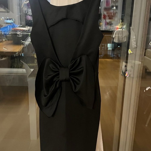 Black mini dress size S like new polyester with open back and large bow