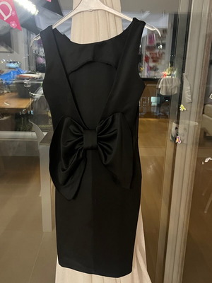 Black mini dress size S like new polyester with open back and large bow