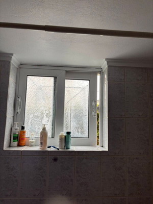 Window used white sliding with slightly fogged glass