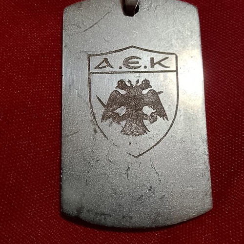AEK stainless steel pendant with engraved emblem, like new
