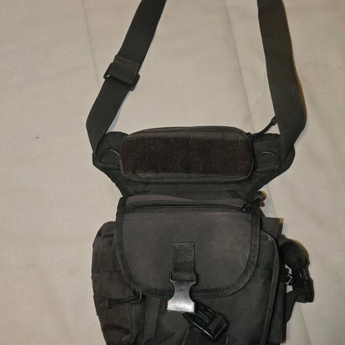 Thigh bag used with multiple compartments and phone pocket
