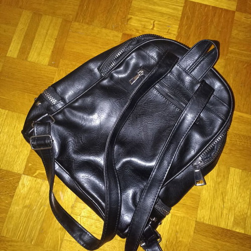 Backpack black leather type used with multiple pockets