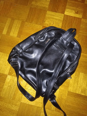 Backpack black leather type used with multiple pockets