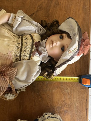 Porcelain doll with hat and basket, 52 cm
