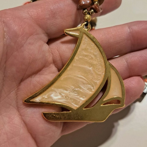 Necklace like new with multicolored beads and gold sailboat pendant