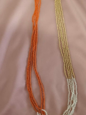 Long necklace new with small crystals for shine, white and orange