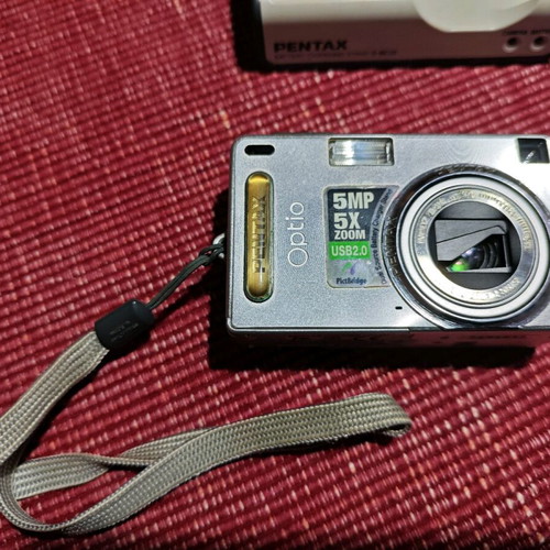 Pentax Optio SVi digital camera used with case and charger