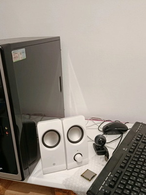 Desktop computer with speakers, keyboard, and camera used
