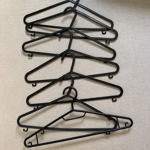 Set of 7 black hangers like new
