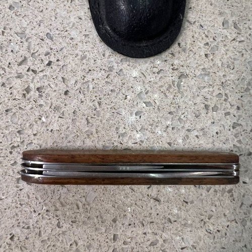 Folding knife used from 1980s with sheath