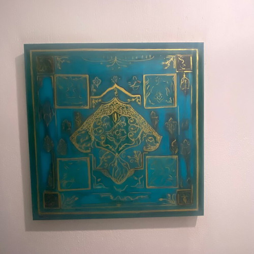 Turquoise board with a gold hamsa hand