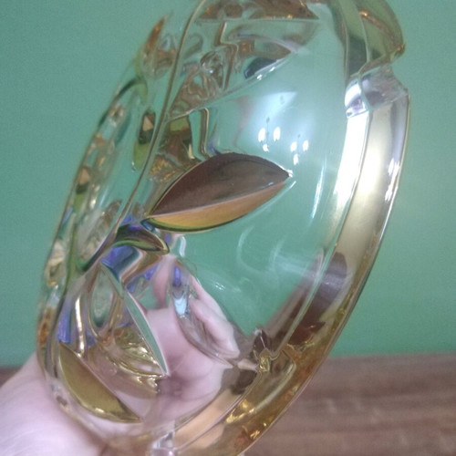 Crystal ashtray used, heavy with embossed gold-plated designs