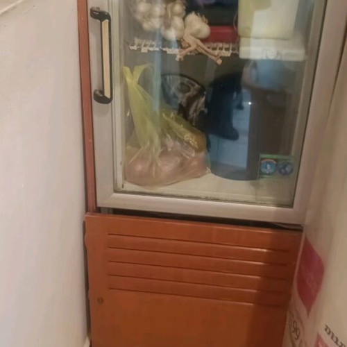 Small refrigerator used, wood-trimmed display suitable for cafes and bars