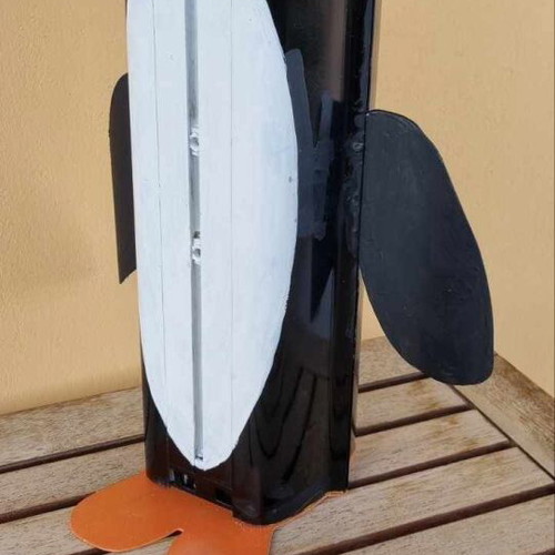 Decorative penguin like new made from recycled CCTV camera