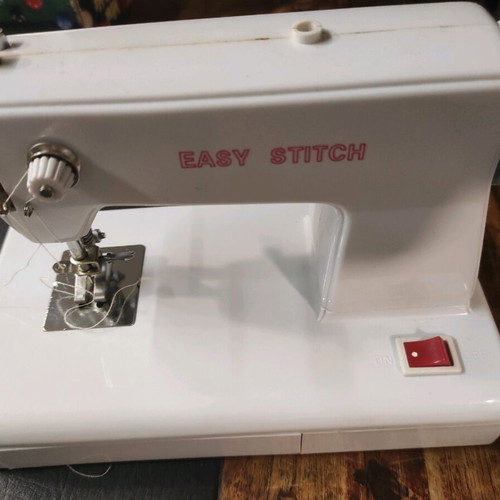 Mini sewing machine used with threads and battery operation