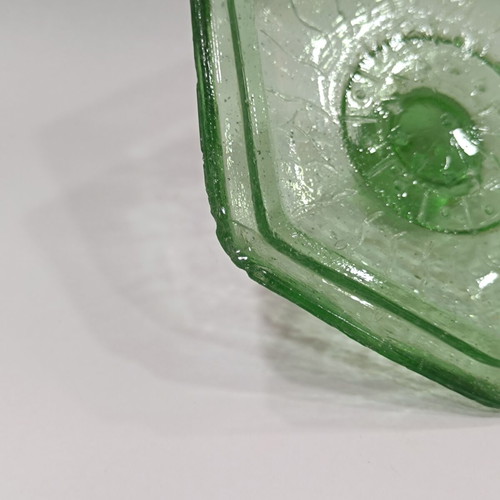 Vintage green pressed glass jewelry box with embossed lid and ridges