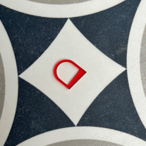 Plexiglass ring like new with red transparent color and unique design