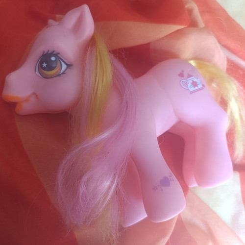 Large pink pony toy with colorful mane and tail